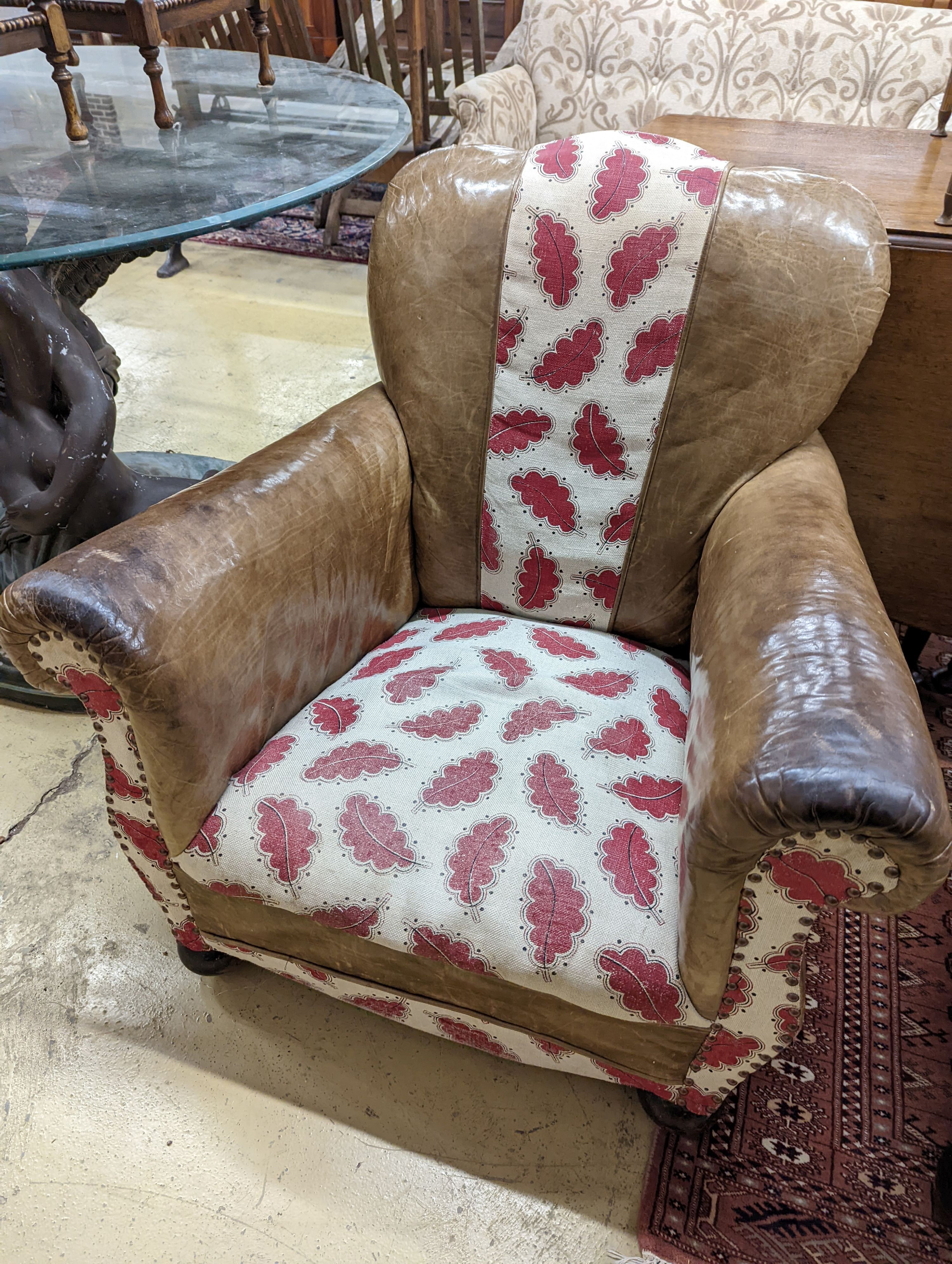 A pair of leather and fabric club armchairs. H-80cm.